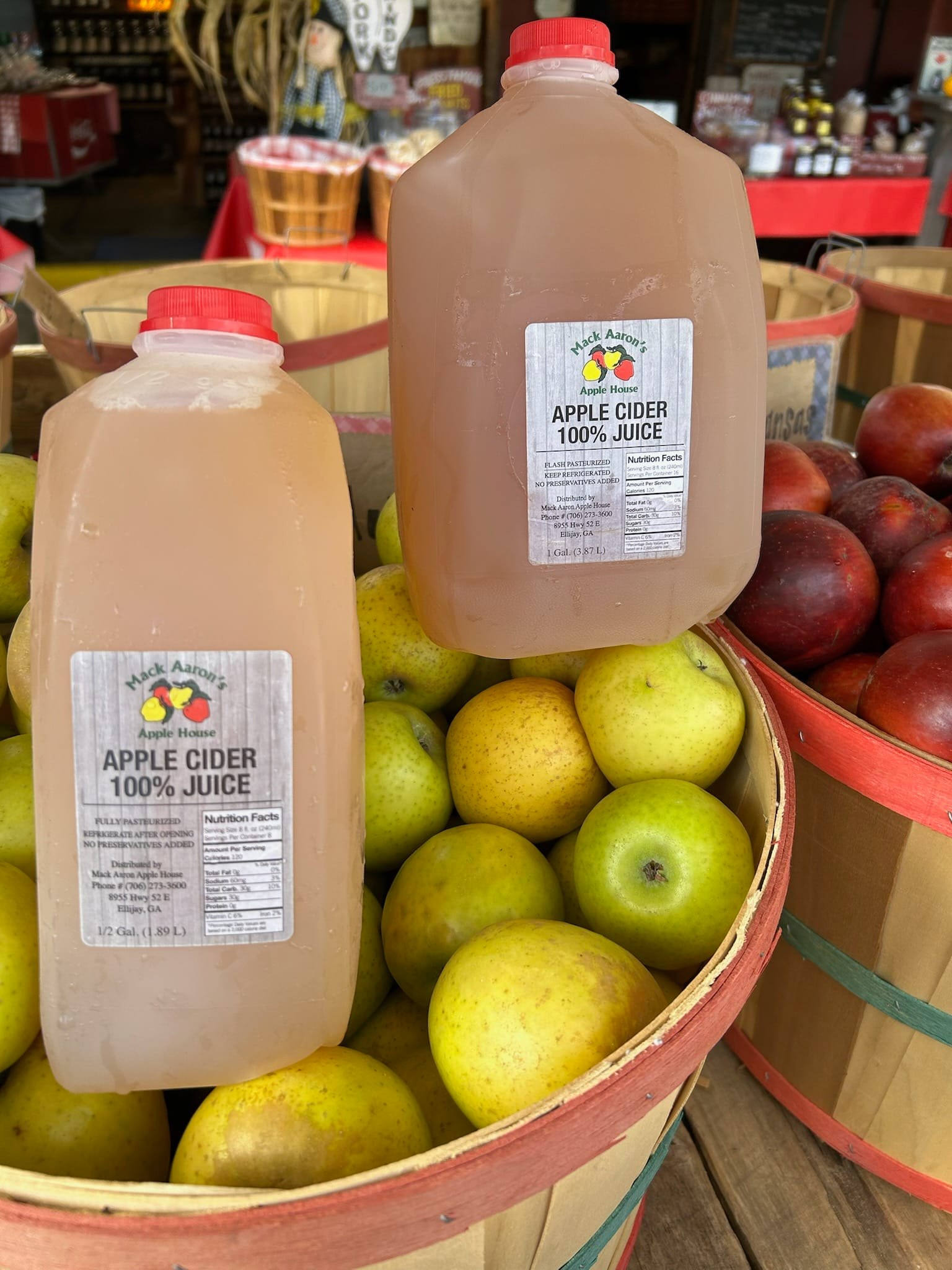 Half-gallon and gallon jugs of fresh apple cider at Fred's Famous Peanuts